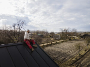 St. Petersburg FL roofing contractor examining rooftop after installation